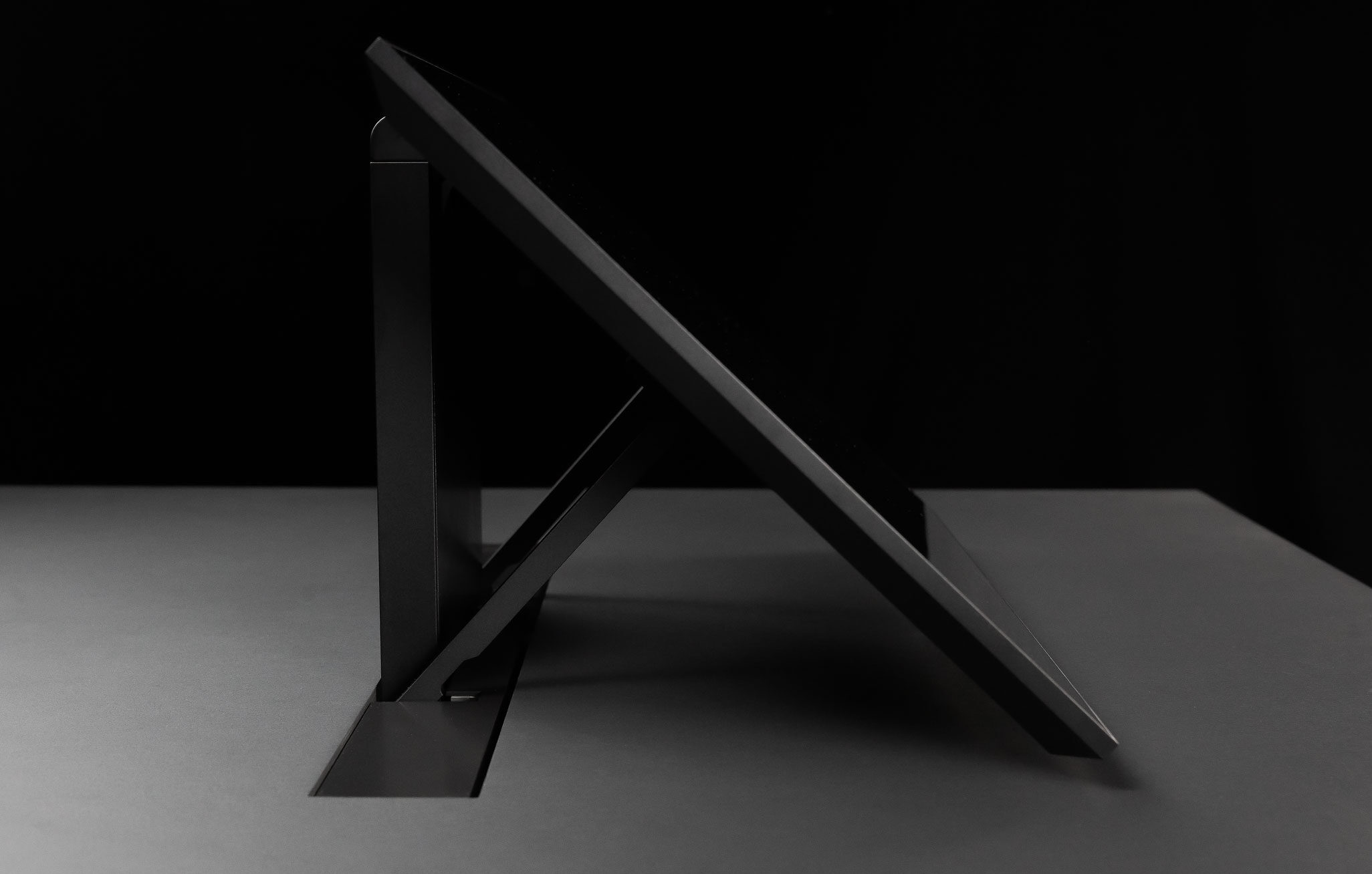 hese include the ability to adjust the screen’s position on the table to limit its height, addressing ergonomic comfort needs and ensuring visibility for people seated around a meeting table.